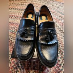 Nunn Bush Men's Leather Loafers, Black, Size 12. Gently Used. Black Wingtip Slip-on Moccasins, Black Slip-on Moccasins, Black Cap Toe Semi-formal Loafers, Black Round Toe Slip-ons For Semi-formal Occasions, Black Slip-on Tassel Loafers With Rubber Sole, Black Tassel Loafers With Rubber Sole, Black Leather Footbed Wingtip Moccasins, Black Wingtip Loafers With Leather Footbed, Black Wingtip Moccasins With Branded Insole