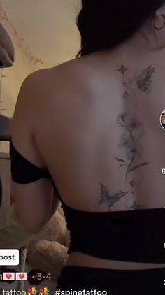 the back of a woman with tattoos on her chest