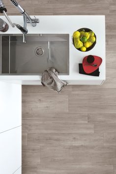 an overhead view of a kitchen sink and counter