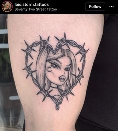 a woman's face is surrounded by barbed wire