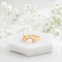 The Eden ring is inspired by the Garden of Eden in the Bible. It is a symbol of the natural beauty, purity, and paradise that is reflected throughout the journey of motherhood. Nature-inspired Stackable Rings For Gifts, White Sterling Silver Nature-inspired Rings, Ethereal Birthstone Rings For Gifts, Birthstone Rings For Gifts, Nature-inspired White Sterling Silver Rings, Ethereal White Rings For Anniversary, Adjustable White Nature-inspired Rings, Nature-inspired White Promise Ring, White Nature-inspired Promise Ring