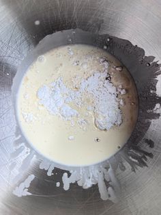 a metal bowl filled with powdered sugar