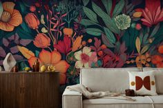 a living room with a floral wallpaper and couch in the foreground is a wooden cabinet