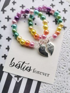 "Rainbow pearl best friends bracelet, heart charms, friendship, besties, classmate gift, kids bracelet. One SET of TWO bracelets. Friendship bracelets, for your magical best friend. this listing is for TWO (2) bracelets. When checking out, let us know the following: 1) colour scheme you would like  DETAILS and MEASUREMENTS: Beads vary in sizes from 6mm-10mm. The length of a bracelet is 6.5\" (we can make them smaller or bigger for you). You may also check our Social Media pages, if you are looki