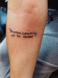 a person with a tattoo on their arm that says, remember everything will be alright