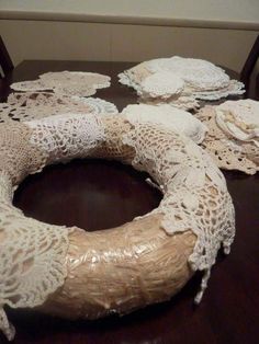 several doily pieces are arranged on a table