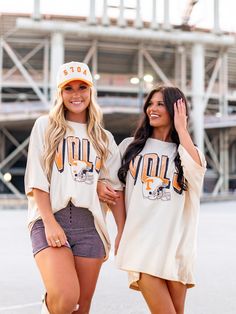 Get your game on with the Vols Helmet Fade Oversized Tee! This officially licensed shirt gives you an old school look while showing your love for the University of Tennessee. With a quirky style and playful tone, this tee is perfect for any true fan. Go Vols! Oversized Fan Apparel Tops For Game Day, Oversized T-shirt For Game Day In Fall, Collegiate Oversized Top With Graphic Print, Retro Oversized T-shirt For College, Oversized Collegiate Top With Graphic Print, Retro Game Day Tops With Text Print, Oversized Collegiate T-shirt For Game Day, Retro Tops With Text Print For Game Day, Oversized Collegiate T-shirt For College