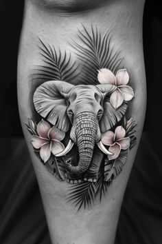 an elephant with pink flowers on his leg