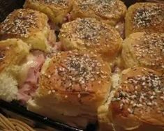 rolls with meat and sesame seeds in a basket