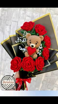 a teddy bear holding roses in its hand