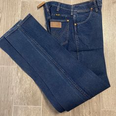 "Vintage Wrangler Denim-plain denim  Wrangler Black Tag- Made in the USA Best Fits: Size: 27\" Inseam:  Vintage Size: Size: 5 Inseam: 36\" 🌵Please Note🌵Vintage sizes can differ greatly from modern day sizing.  Please message with any questions prior to purchase. ✨All Sales Final ✨No Returns✨" Dark Wash High Rise Jeans For Rodeo, Western Denim Jeans With Pockets, High Rise Dark Wash Jeans For Rodeo, Medium Wash Jeans With Pockets For Rodeo, Western Style Denim Blue Jeans With Pockets, Western Denim Blue Jeans With Pockets, Western Style Jeans With Pockets In Denim Blue, Vintage Dark Wash Jeans For Rodeo, Vintage Denim Jeans For Rodeo