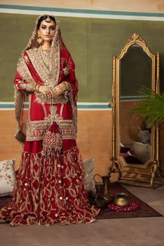 Red Bridal Sharara Shirt Pakistani Wedding Dresses in Heavy Sequins, Gota, Mukesh work on Raw Silk for Pakistani Bridal Wear. Customizable. Fast Shipping Nida Sharara With Mirror Work For Wedding, Red Nida Sharara With Mirror Work, Hand Embellished Sharara For Traditional Ceremonies, Hand Embellished Traditional Sharara For Ceremonies, Red Mirror Work Salwar Kameez For Wedding, Red Salwar Kameez With Mirror Work For Weddings, Wedding Nida Sets With Mirror Work, Festive Sharara With Stone Work For Eid, Wedding Sets With Mirror Work In Nida