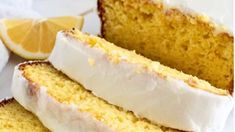 two slices of lemon cake with white frosting and one slice cut from the cake