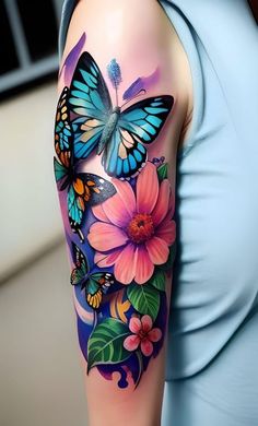 a woman's arm with butterflies and flowers on it