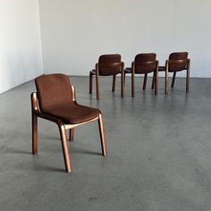 Set of four mid-century modern dining chairs with bentwood frames and dark brown upholstery. Manufactured in Italy during the 1980s, the chairs feature a sleek curved form and a one piece seat-backrest. Chairs are in overall good vintage condition with signs of use. Wooden construction on all chairs has some dents and scratches, as expected with age and use. The upholstery of the chairs is in good condition, but with some more signs of age - mostly surface scuffs. The chairs can still be used as 1970s Dining Chairs, Mid Century Modern Dining Chairs, Large Storage Cabinets, Midcentury Modern Dining Chairs, Wooden Construction, Big Sofas, Vintage Dining Chairs, Brown Furniture, Mid Century Modern Dining