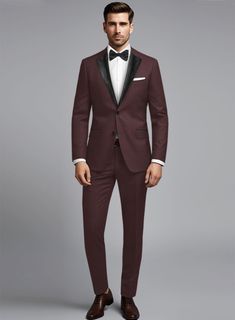 Make your presence felt in style with this wine tuxedo suit offering style and sophistication effortlessly with sleek style. Crafted from wool blend, the tuxedo suit is a trending essential you will surely need to pump up your elegant style personality.  Featuring satin lapel, matching satin covered buttons and gentle texture at its surface, our tuxedo is a subtle fashion-forward take on a traditional tailoring.  Look Includes   Napolean Wine Wool Fabric  Two Button Tuxedo Jacket Style  Notch Lapel  Black Tuxedo Buttons  Single Vent  Three Cuff Buttons  Two Welted Back Pockets on Trousers   Click 'Customize Now' to modify the look if needed.  Jacket is fully lined while the Pants do not have satin lining.  Lining: Viscose; Dry Clean. Formal Custom Fit Three-piece Suit With Notch Lapel, Formal Three-piece Suit With Notch Lapel, Tailored Three-piece Suit With Pressed Crease For Evening, Tailored Three-piece Evening Suit With Pressed Crease, Evening Tailored Three-piece Suit With Pressed Crease, Evening Three-piece Tailored Suit With Pressed Crease, Tailored Double Breasted Party Suit, Elegant Burgundy Suit And Tie Accessories For Business, Elegant Single Button Tuxedo For Formal Occasions