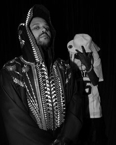 a man in a black and white photo with a mask on