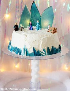 a frozen cake with frosting and decorations on top