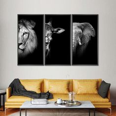 three black and white pictures of animals on a wall above a couch in a living room