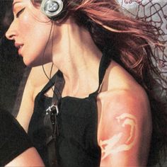 a woman with headphones on her ears