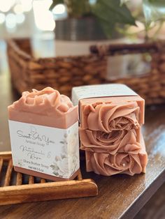 two soap bars sitting on top of a wooden tray