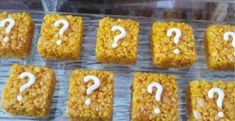 several square treats with question marks on them