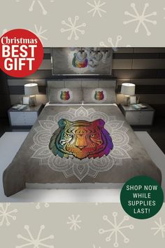 a bed with a colorful tiger on it and the words christmas best gift above it