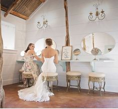 two brides are getting ready for their wedding at the same time as they stand in front of an antique vanity