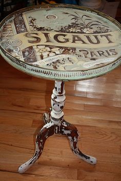 a glass table sitting on top of a hard wood floor