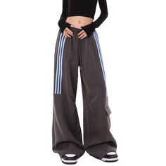 Elevate your loungewear collection with our Women's American Street Multi-Pocket Sweatpants. Crafted with luxurious fabric, these sweatpants feature multiple pockets for added convenience and functionality. Perfect for a stylish and comfortable look, these sweatpants are a must-have for the sophisticated woman on-the-go. Features: -55% Polyester,45% Cotton -Adjustable Waistband -Straight Leg -Multi-Pocket -MId-rise waist -Regular fit -Street style