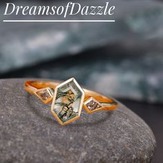 a close up of a ring on a rock with the words dreams of gaze above it