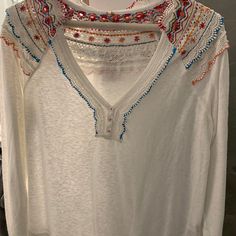 White Cotton Blouse With Multi-Colored Embroidered Detail On Collar And Back. Brand New, Never Worn. White V-neck Top With Intricate Embroidery, White V-neck Blouse With Intricate Embroidery, Casual Multicolor Tops With Embroidered Sleeves, White Long Sleeve Tops With Intricate Embroidery, White Long Sleeve Top With Intricate Embroidery, White Cotton V-neck Embroidered Top, Multicolor Long Sleeve Top With Embroidered Sleeves, White Long Sleeve Top With Embroidered Hem, White Long Sleeve Bohemian Top