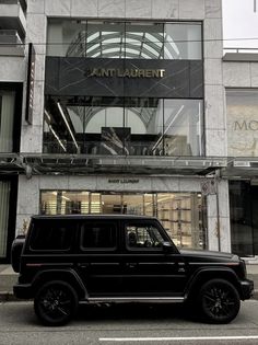 a black jeep parked in front of a building