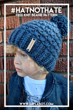 a young child wearing a blue knitted hat with a button in the middle and text overlay that says, free knit beanie pattern