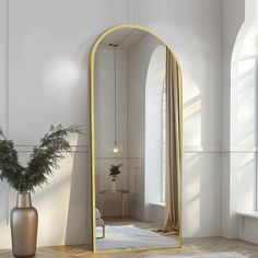 a large mirror sitting on top of a wooden floor next to a potted plant