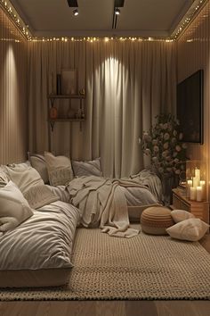 a living room filled with lots of pillows and blankets on top of a wooden floor