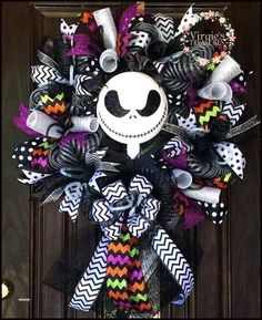 a halloween wreath with a skeleton on it