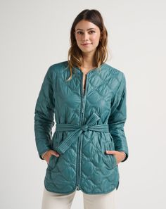 The SALTWATER SPRAY midi jacket instantly and effortlessly elevates your look. With timeless details like onion-stitch quilting, self-belt, and a high/low silhouette, stroll into the day’s plans with confidence and comfort. Quilted long jacket Relaxed fit Front facing pockets Onion-stitch quilting throughout Zipper enclosure Self-sash attachment High/low style: front of garment is shorter than back | TravisMathew Women's Saltwater Spray Quilted Golf Jacket Size Large in North Atlantic Spring Travel Fitted Outerwear, Fitted Spring Travel Outerwear, Quilted Outerwear For Travel In Fall, Quilted Outerwear For Fall Travel, Fall Travel Quilted Outerwear, Long Sleeve Outerwear For Travel In Fall, Green Travel Outerwear With Pockets, Long Sleeve Outerwear For Fall Travel, Long Sleeve Fall Travel Outerwear