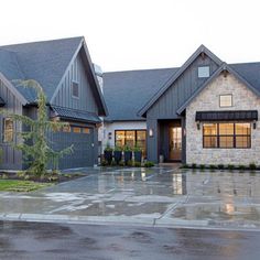 a large house with two garages on each side