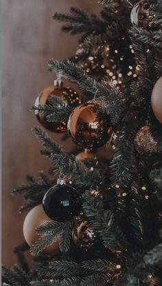 a christmas tree with ornaments hanging from it