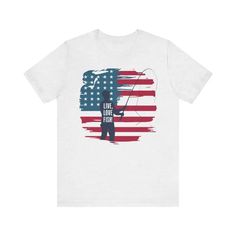 Hook, Line & Liberty Unisex Jersey Tee For July FishingReel in patriotic style with our Unisex Jersey Tee for your 4th of July fishing adventures. This classic, soft cotton jersey tee fits like a well-loved favorite, making it perfect for a day on the water or chilling at the campsite. The quality print and 100% Airlume combed and ring-spun cotton fabric ensure you stay comfortable while looking great. With its ribbed knit collar and tapered shoulders, this jersey tee offers a flattering, comfor Short Sleeve Tops For Summer Fishing, Graphic Print Shirt For Fishing In Summer, Summer Fishing Tops With Crew Neck, Summer Fishing T-shirt With Crew Neck, Summer Crew Neck T-shirt For Fishing, Crew Neck T-shirt For Summer Fishing, Graphic Print Short Sleeve T-shirt For Fishing, White Cotton T-shirt For Fishing, Graphic Tee T-shirt For Fishing