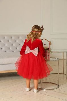 For more dresses for girls https://www.etsy.com/shop/ANGELOVEStore?ref=simple-shop-header-name&listing_id=691016892&section_id=26379200Orders made after December 10 will not be in time for Christmas. Charming dress for the baby with a fluffy skirt. If your event is planned in the cold season, then these dresses are just made to decorate you. Surprisingly soft velor red color on the top is soft to the touch. It will be comfortable to your baby. The belt is decorated with a sequin. Bow on Dresses For Christmas Party, Dresses For Christmas, Xmas Outfit, Red Holiday Dress, Fluffy Skirt, Dresses For Girls, Sequin Bow, Christmas Party Dress, Special Occasion Dress