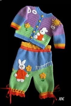 a crocheted baby's outfit with bunny on it