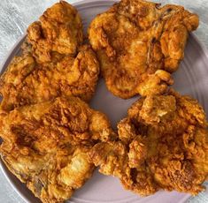 fried chicken pieces on a plate ready to be eaten