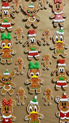 gingerbread cutouts are arranged in the shape of santas, reindeers and snowmen