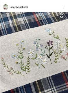 an image of some flowers on a plaid table cloth with the words sachyosakaku