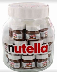 nutella jars are stacked in a glass container