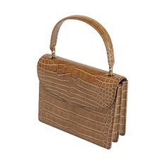 Isabella is presented in the finest brown authentic alligator leather, making it the perfect choice for formal events. This upscale handbag features high-quality Cafe Glossy alligator leather for the main body, gussets, back body, top flap, handle, bottom, vistas, and pouch, offering a luxurious and cohesive texture. Handcrafted by generational artisans, Isabella exemplifies meticulous craftsmanship and timeless elegance, ensuring that it stands out in any setting. The rich Cafe Glossy alligator leather provides a sophisticated and exotic look, while the sturdy handle blends style and functionality effortlessly. Timeless Formal Bag With Crocodile Pattern, Timeless Formal Bags With Crocodile Pattern, Luxury Crocodile Pattern Shoulder Bag For Formal Occasions, Luxury Crocodile Pattern Shoulder Bag For Formal Events, Elegant Crocodile Pattern Shoulder Bag For Formal Occasions, Classic Brown Evening Bag With Top Handle, Classic Formal Shoulder Bag With Crocodile Pattern, Classic Crocodile Pattern Shoulder Bag For Formal Occasions, Luxury Formal Satchel With Crocodile Pattern