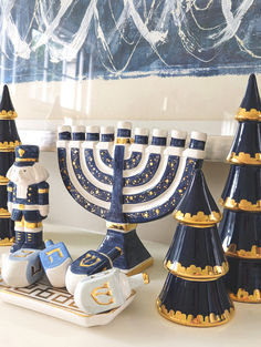 a hanukkah menorah is sitting on a tray next to other decorations