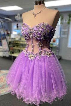 a purple dress on display in a store